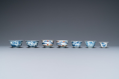 Twenty-seven Chinese blue and white saucers and seven cups, Kangxi and later