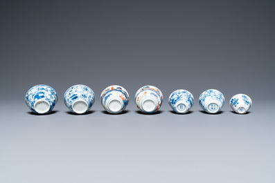Twenty-seven Chinese blue and white saucers and seven cups, Kangxi and later