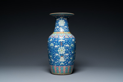 A Chinese famille rose blue-ground 'bajixiang' vase, 19th C.