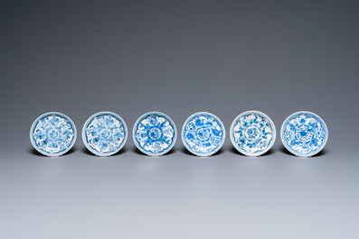Twenty-seven Chinese blue and white saucers and seven cups, Kangxi and later