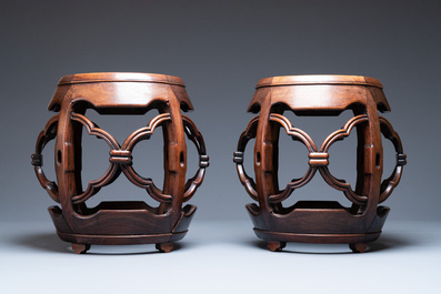 A pair of Chinese reticulated hongmu wooden stands with marble 'dreamstone' plaques, 19th C.