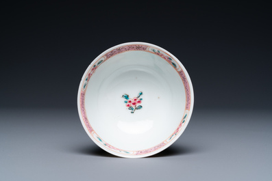 A Chinese famille rose cup and saucer with a couple on a terrace, Qianlong