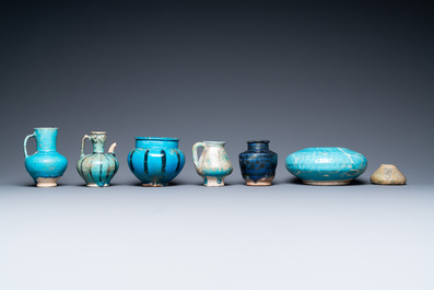 Une collection de sept vases et verseuses en c&eacute;ramique &agrave; &eacute;mail turquoise, Moyen-Orient, 13&egrave;me et apr&egrave;s