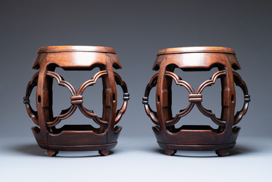 A pair of Chinese reticulated hongmu wooden stands with marble 'dreamstone' plaques, 19th C.