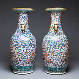 A pair of large Chinese famille rose 'dragon' vases, 19th C.