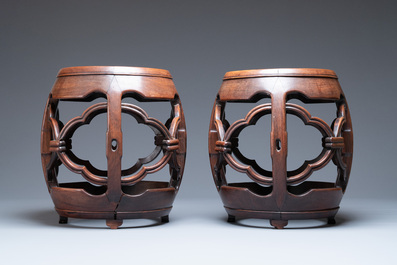 A pair of Chinese reticulated hongmu wooden stands with marble 'dreamstone' plaques, 19th C.