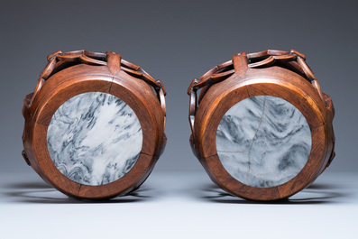 A pair of Chinese reticulated hongmu wooden stands with marble 'dreamstone' plaques, 19th C.