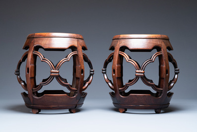 A pair of Chinese reticulated hongmu wooden stands with marble 'dreamstone' plaques, 19th C.
