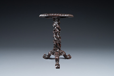 A Chinese wooden table with a Canton famille rose plaque, 19th C.