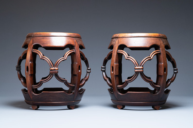 A pair of Chinese reticulated hongmu wooden stands with marble 'dreamstone' plaques, 19th C.