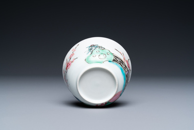A Chinese famille rose cup and saucer with a couple on a terrace, Qianlong