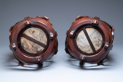 A pair of Chinese reticulated hongmu wooden stands with marble 'dreamstone' plaques, 19th C.
