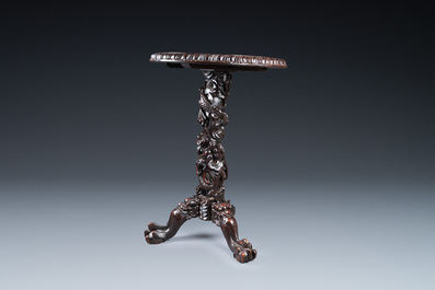 A Chinese wooden table with a Canton famille rose plaque, 19th C.