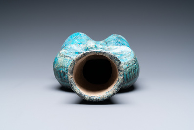 A turquoise- and black-glazed pottery figurative ewer, Kashan, Iran, 12/13th C.