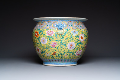 A large Chinese famille rose yellow-ground fish bowl with fine floral scrolls, 19th C.