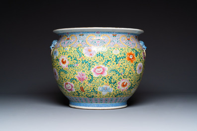 A large Chinese famille rose yellow-ground fish bowl with fine floral scrolls, 19th C.