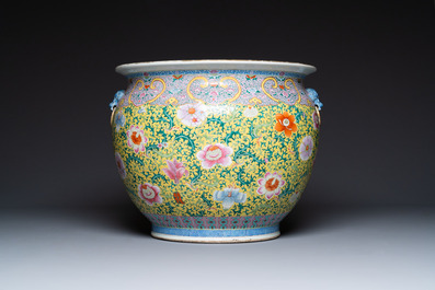 A large Chinese famille rose yellow-ground fish bowl with fine floral scrolls, 19th C.