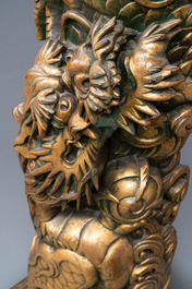 A large Chinese gilded wooden 'dragon' stand, 19th C.
