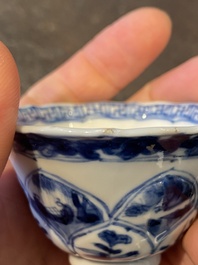Three Chinese blue and white lotus-shaped 'acupuncture' cups and saucers, Kangxi