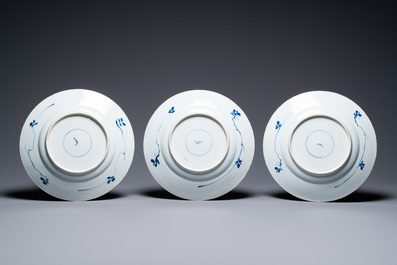 A Chinese blue and white 'dragon' dish and seven floral plates, Kangxi and later