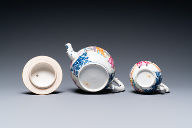 A Chinese famille rose 'Mandarin' teapot and milk jug, Qianlong