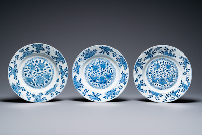 A Chinese blue and white 'dragon' dish and seven floral plates, Kangxi and later