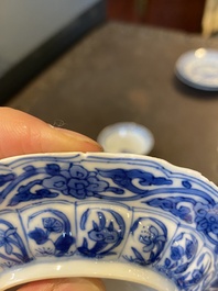 Three Chinese blue and white lotus-shaped 'acupuncture' cups and saucers, Kangxi