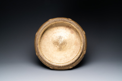 A Tibetan brass ewer, an alms bowl and an Indian bronze ewer, 18/19th C.