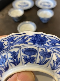 Three Chinese blue and white lotus-shaped 'acupuncture' cups and saucers, Kangxi