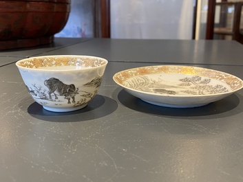A Chinese grisaille cup and saucer with buffaloes, Yongzheng