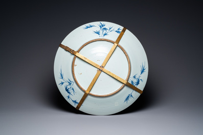 A large Chinese blue and white dish and a floral bowl, 19th C.