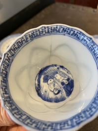 Three Chinese blue and white lotus-shaped 'acupuncture' cups and saucers, Kangxi