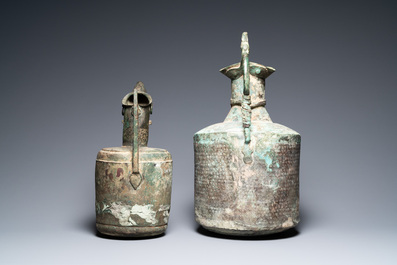 Two large Persian bronze ewers, Khorasan, Iran, 13/15th C.