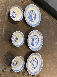 Three Chinese blue and white lotus-shaped 'acupuncture' cups and saucers, Kangxi