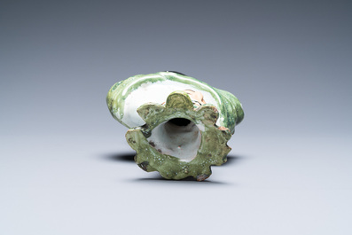 A polychrome French faience candlestick in the shape of a man, 18th C.