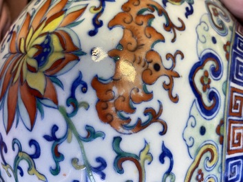 A Chinese doucai 'lotus scroll' bottle vase, Qianlong mark, 18/19th C.