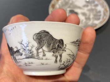 A Chinese grisaille cup and saucer with buffaloes, Yongzheng