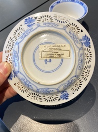 A pair of Chinese blue and white reticulated double-walled cups and saucers, Kangxi