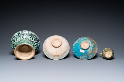 Two turquoise- and black-glazed dishes, three bowls, a jug and a small lion, Raqqa and Nishapur, Middle-East, 12/13th C. and later