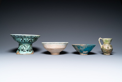 Two turquoise- and black-glazed dishes, three bowls, a jug and a small lion, Raqqa and Nishapur, Middle-East, 12/13th C. and later