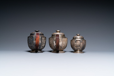 Two Vietnamese silver teapots and a sugar bowl and cover, marked Donghung, ca. 1900
