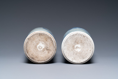 A pair of Chinese blue and white rouleau vases with birds among blossoming branches, Transitional period