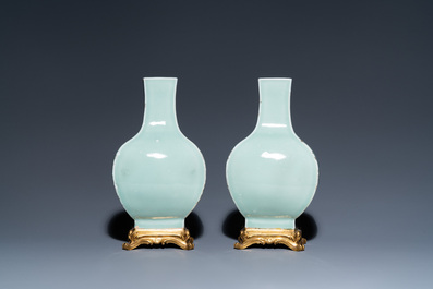 A pair of Chinese monochrome celadon vases with gilt bronze mounts, 18/19th C.