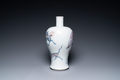 A Chinese blue, white and copper-red 'meiping' vase with mythical animals, Qianlong mark, 18/19th C.