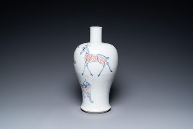 A Chinese blue, white and copper-red 'meiping' vase with mythical animals, Qianlong mark, 18/19th C.