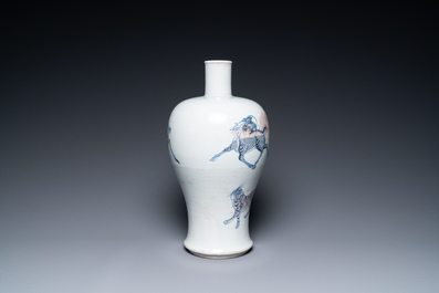 A Chinese blue, white and copper-red 'meiping' vase with mythical animals, Qianlong mark, 18/19th C.