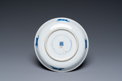 A Chinese blue and white covered cup and saucer for the French market, Kangxi