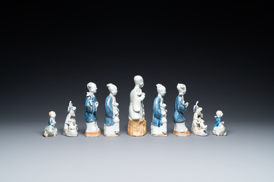Nine Chinese blue and white and celadon-glazed groups and figures, Qianlong