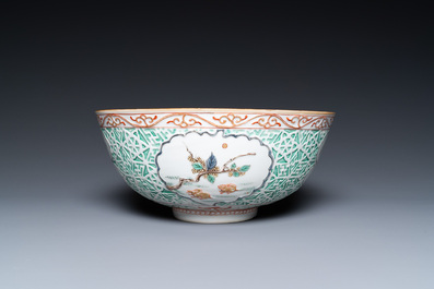 A Chinese famille verte relief-decorated bowl with squirrels and rabbits, Kangxi