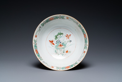 A Chinese famille verte relief-decorated bowl with squirrels and rabbits, Kangxi